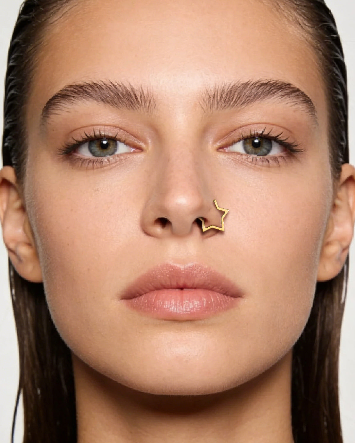 gold star clicker nose piercing
