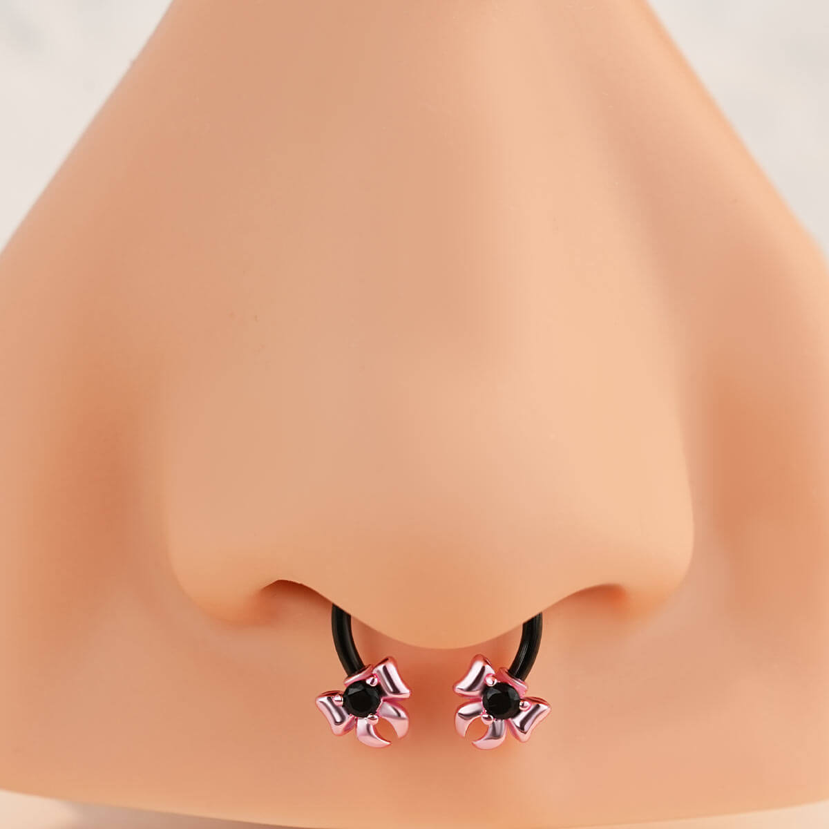 pink bow septum piercing
