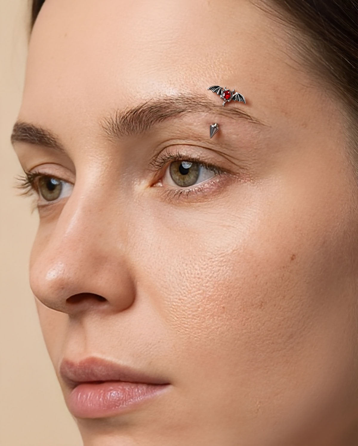 bat wing eyebrow piercing