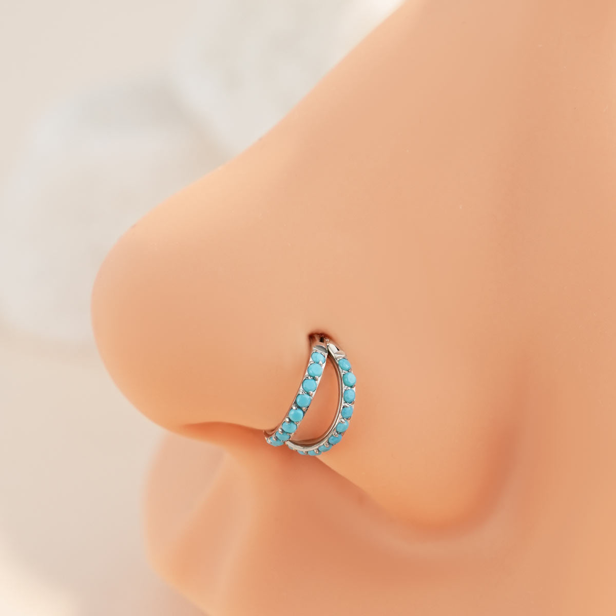 turquoise nose piercing
