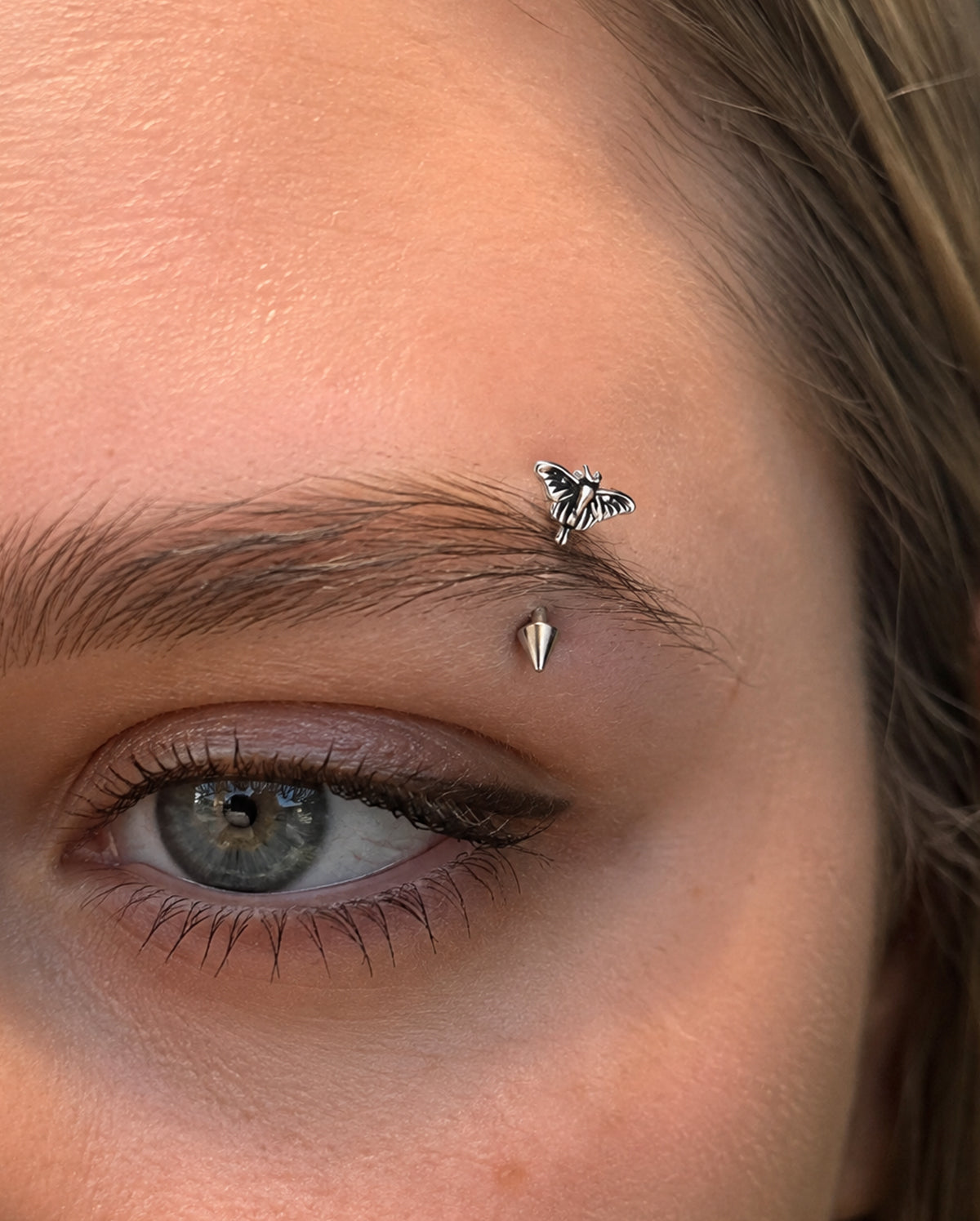 Moth Spike Curved Barbell Eyebrow Piercing