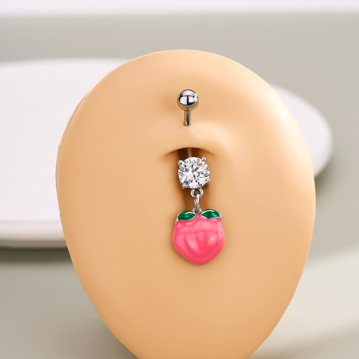 pink belly button piercing