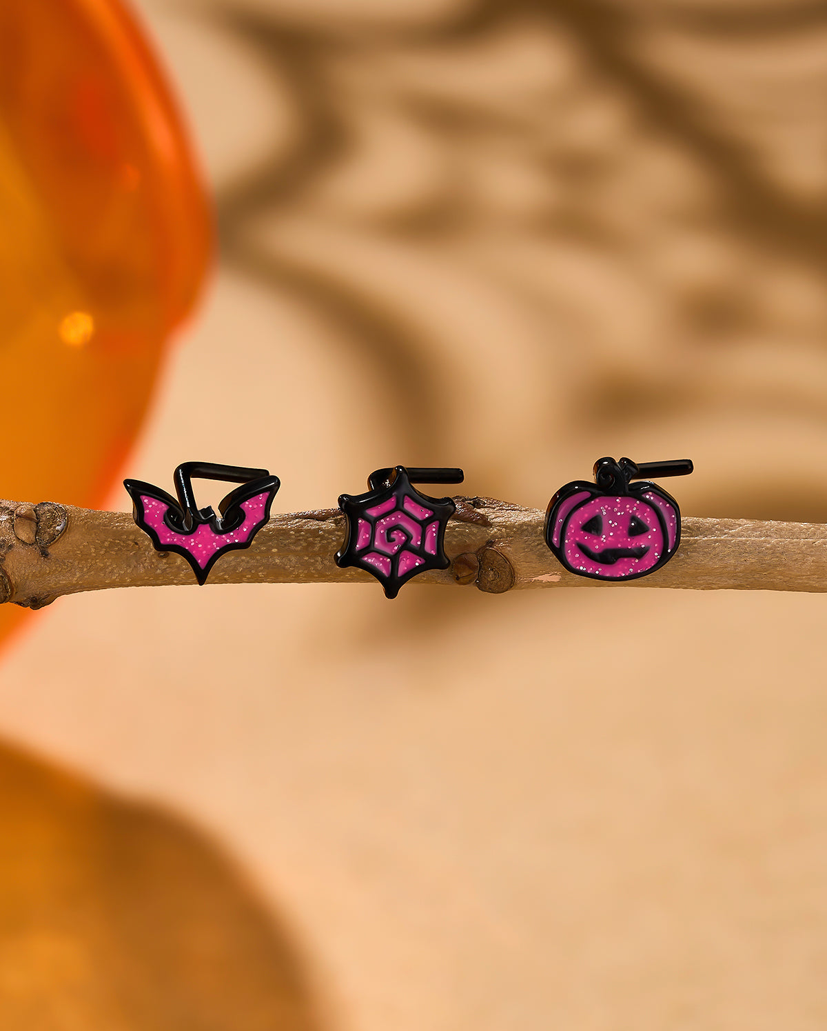 pink L shaped nose studs