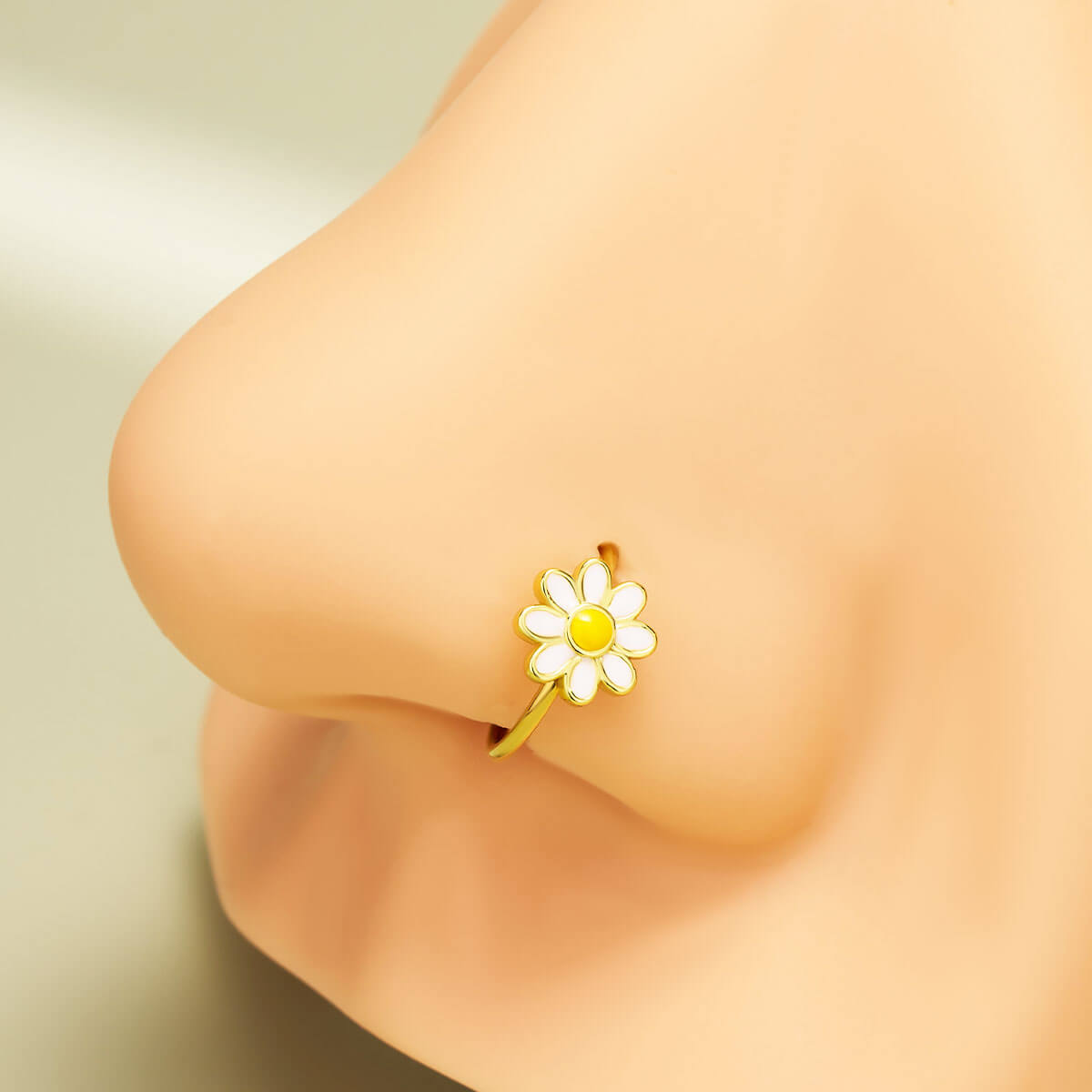 gold daisy nose piercing